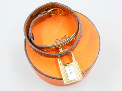 null HERMES Paris. Kelly" model. 

Gold-plated lady's watch, padlock dial, double-turn...
