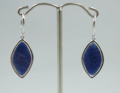 null Pair of 18k white gold earrings holding two faceted marquise-cut sapphires for...