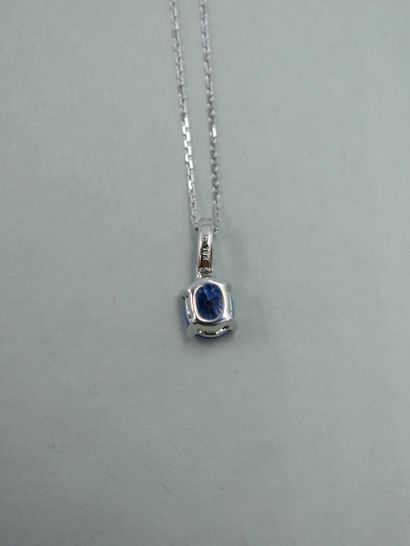 null 18k white gold pendant set with an oval sapphire weighing approximately 1.50cts,...