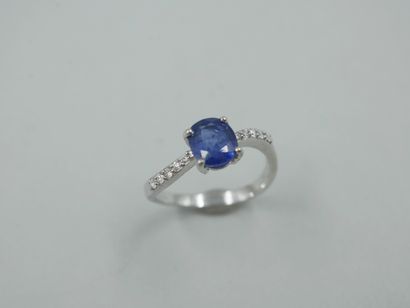 null 18k white gold ring set with an oval sapphire weighing approximately 1.20cts,...