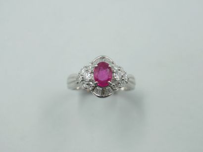 null 18k white gold ring set with an oval ruby of 1ct approx., surrounded by flower...