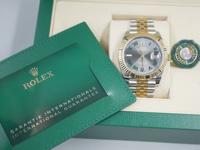 null 
ROLEX OYSTER PERPETUAL DATE JUST.

Men's watch in steel and 18k yellow gold....