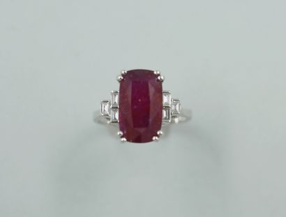 null 18k white gold ring set with a 5.09cts oval natural ruby and baguette-cut diamonds....