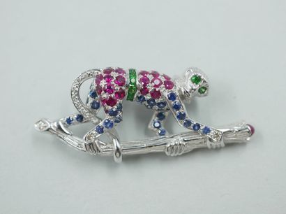 null Brooch in 18k white gold representing a small monkey on its branch set with...