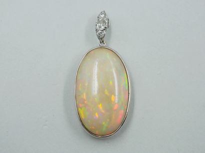 null Pendant in 18k white gold set with an opal of 30cts, the hoop paved with diamonds....