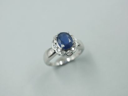 null Flower ring in 18k white gold with an oval sapphire of about 2.50cts in a diamond...