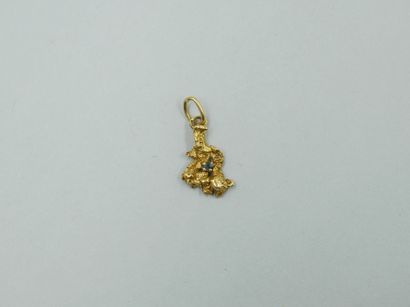 null 18k yellow gold pendant in the shape of a gold nugget set with an emerald. 

Height...