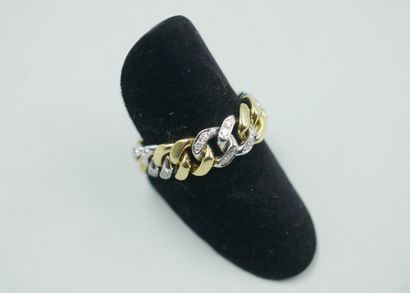 null 18k yellow and white gold soft ring, the white gold links set with diamonds....