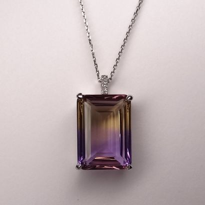 null Pendant in 18k white gold topped by an emerald-cut ametrine of 9cts approximately,...