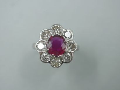 Flower ring in 18k white gold with a ruby...
