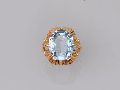 null 18k yellow gold ring set with an oval topaz of about 6cts in a collared setting....