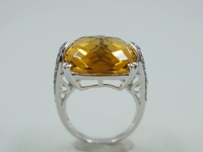 null 18k white gold and rhodium ring set with a faceted cushion-cut citrine in an...
