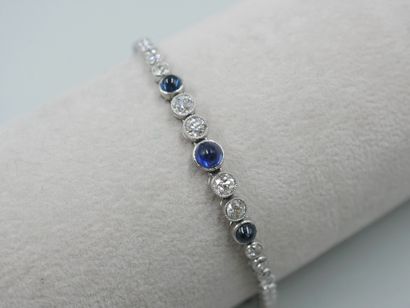 null Flexible bracelet in platinum and 18k white gold decorated with three cabochons...