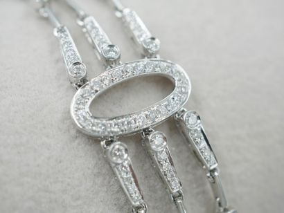 null 18k white gold soft bracalet composed of three rows partially paved with diamonds...