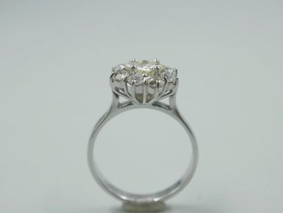 null Flower ring in 9k white gold centered on a square diamond of 0.50ct in a setting...