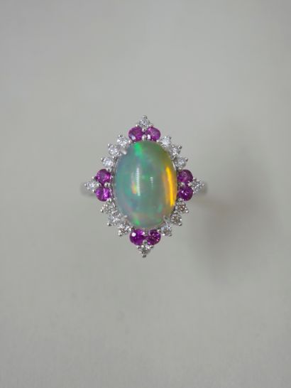 null 18k white gold ring set with a cabochon opal weighing approximately 2.20 cts...