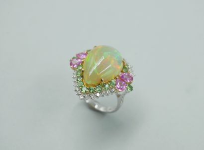 null 18k white gold ring surmounted by a cabochon-cut pear-shaped opal of 8cts approximately...