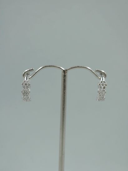 null Pair of 18k white gold hoop earrings set with four brilliant-cut diamonds. 

Dimensions:...