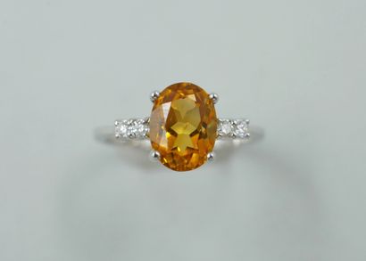 null 18k white gold ring with an oval faceted citrine of about 1ct and diamonds....