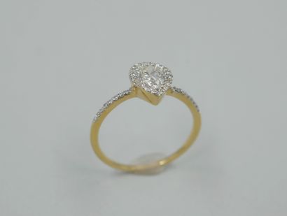 null An 18k yellow gold pear-shaped ring with a 0.50ct pear-shaped diamond in a diamond...