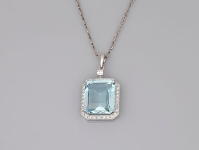 null 18k white gold pendant set with an emerald-cut aquamarine of 14cts in a diamond...