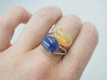 null Vous Moi ring in 18k white gold set with a 5cts opal and a cabochon sapphire...