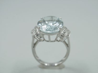 null 18k white gold ring set with a large aquamarine of about 12cts in a double shoulder...