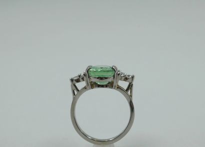 null Rhodium-plated 18k white gold ring surmounted by an oval green paraiba tourmaline...