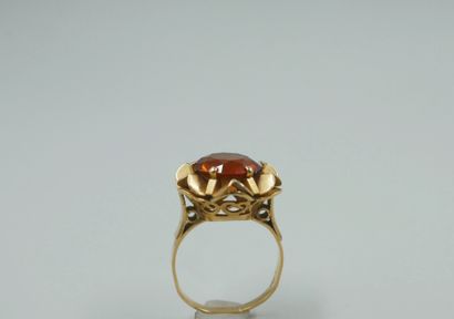 null Corolla ring in 18k yellow gold with an orange sapphire. 

Work of the 1960s....