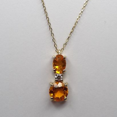 null 18k yellow gold pendant set with two fire opals weighing a total of 0.85cts...