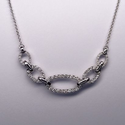 null Necklace in 18k white gold with five oblong links paved with diamonds, the center...