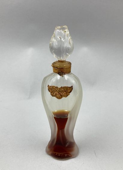 null GUERLAIN "Shalimar

Glass bottle, model " Ode ", amphora-shaped body. Stopper...