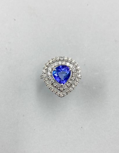 null 18k white gold ring set with a tanzanite of about 2cts in a double surround...