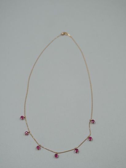 null Necklace in 18k yellow gold with seven rubies in a claw setting for about 3cts....