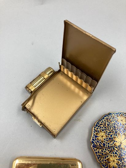 null LANCOME

Lot including: a compact powder box, sealed, a golden enamelled powder...