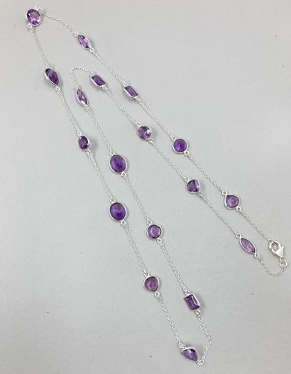 null Long silver necklace punctuated with various patterns set with faceted amethysts.

Length...