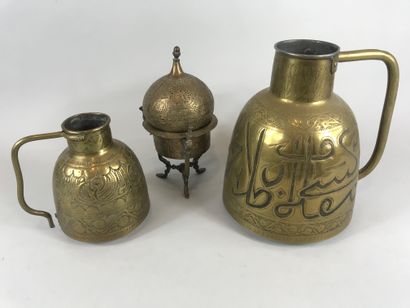 null MAGHREB. 

Set of copper measure decorated with verses of the Koran. 

And a...