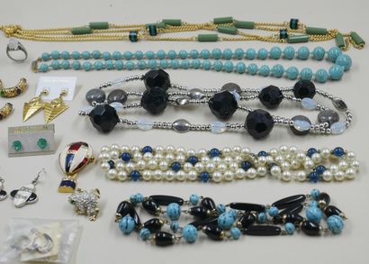 null Lot of costume jewelry including necklaces, brooches, earrings and a ring.