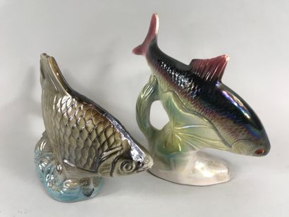null Two glazed earthenware subjects representing fish

Height: 18cm and 14,5cm....
