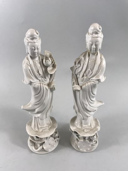 null CHINA, 20th century. 

Two statuettes of Guan Yin standing on a pedestal decorated...