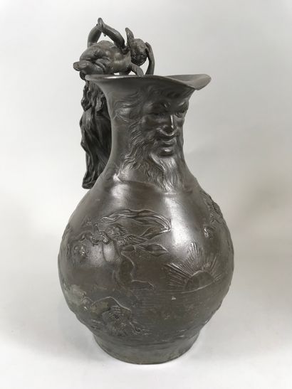 null Charles Théodore PERRON (1862-1934). 

Pewter pitcher. Naiad and cherub. 

Height:...