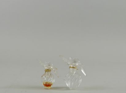 null NINA RICCI "L'air du Temps

Two bottles stoppers two doves, 30ml, one full and...