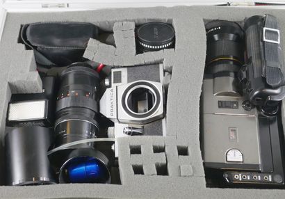 null Case containing a Canon Super 8 sound camera, a Praktica camera. Optima 535...