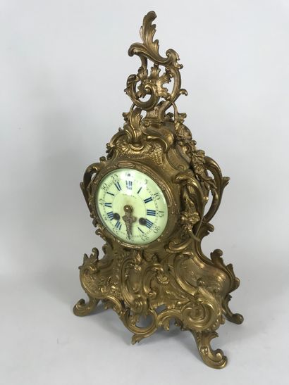 null Gilded bronze mantelpiece including a violin shaped clock decorated with interlacing...