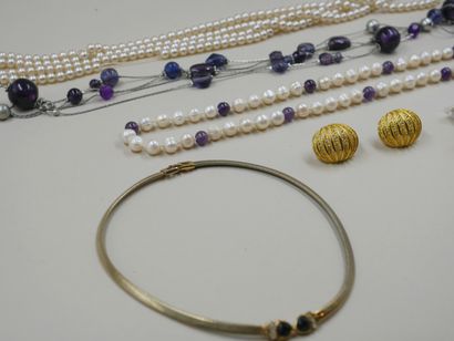 null Lot of costume jewelry including necklaces, pearls, a pair of ear clips and...