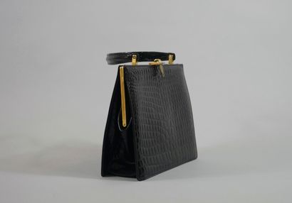 null Vintage handbag in black patent leather. Finished in gold metal and enamel details.

Dimensions...