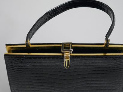 null Vintage handbag in black patent leather. Finished in gold metal and enamel details.

Dimensions...