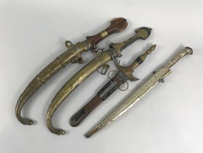 null Set of four daggers from North Africa, one with a wooden handle, another with...