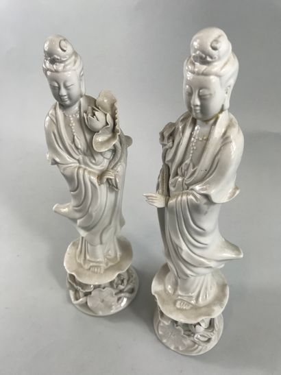 null CHINA, 20th century. 

Two statuettes of Guan Yin standing on a pedestal decorated...