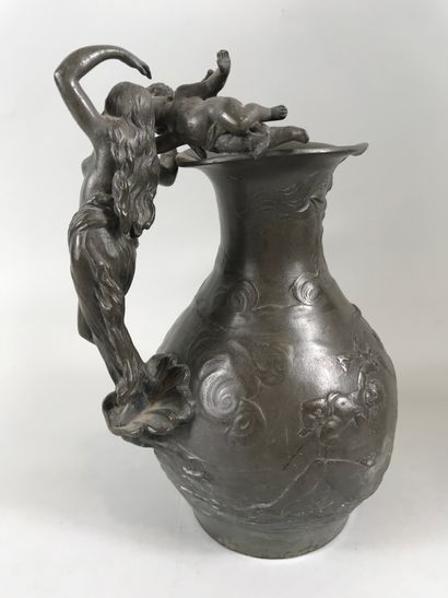 null Charles Théodore PERRON (1862-1934). 

Pewter pitcher. Naiad and cherub. 

Height:...